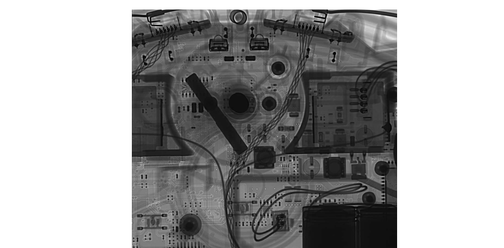 X-ray looking through the front wheel of the device. Note the IR sensors and the boards for the cliff sensors near the top of the image