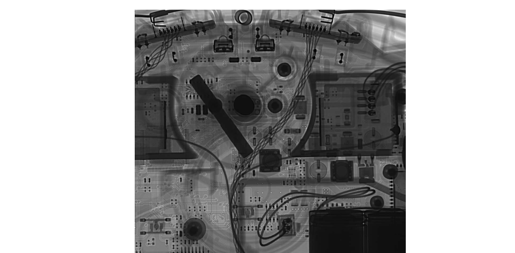 X-ray looking through the front wheel of the device. Note the IR sensors and the boards for the cliff sensors near the top of the image