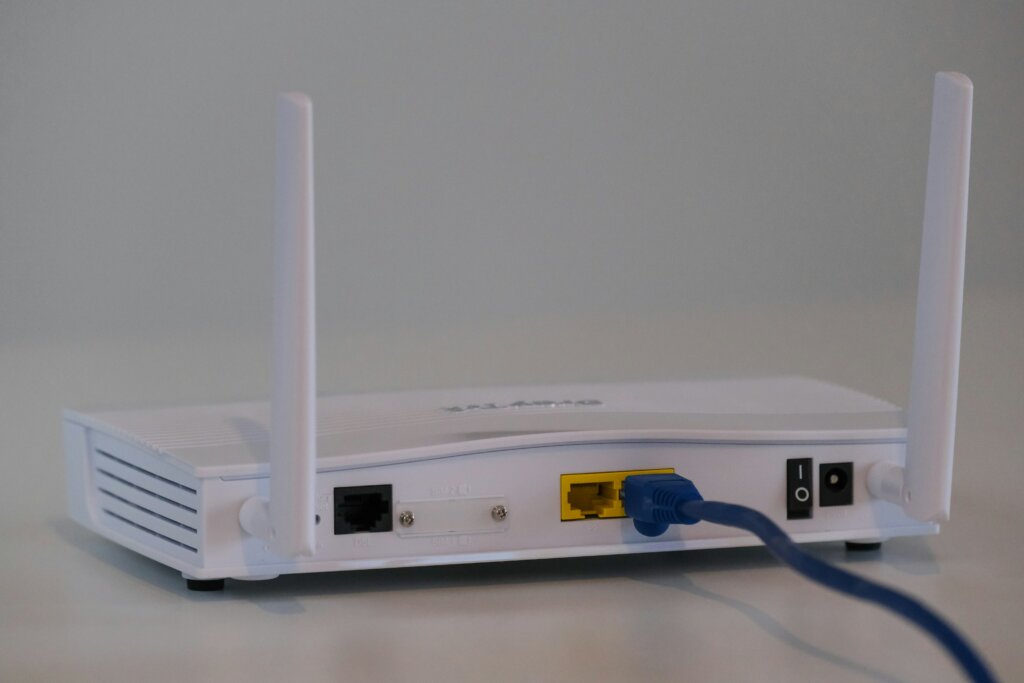 The photo shows a white router.